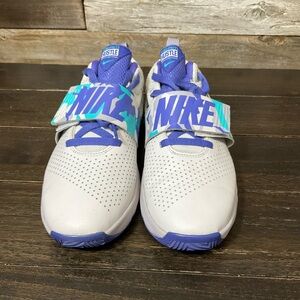Youth Nike Team Hustle D8 basketball shoes in a white, purple, grey, blue camo